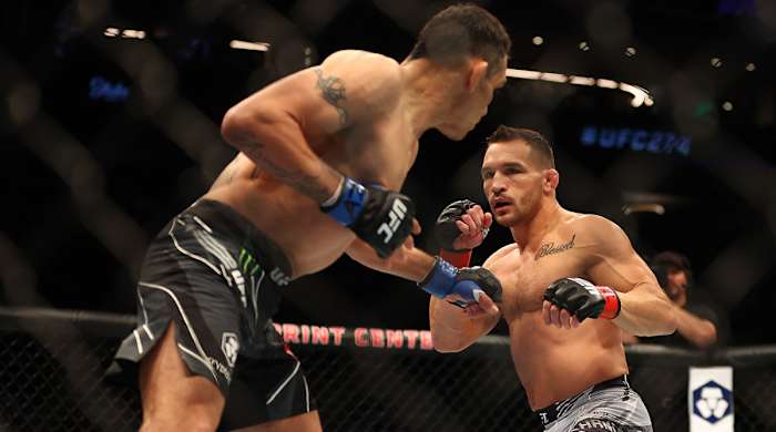 Michael Chandler fights against Tony Ferguson during UFC 274 at Footprint Center.